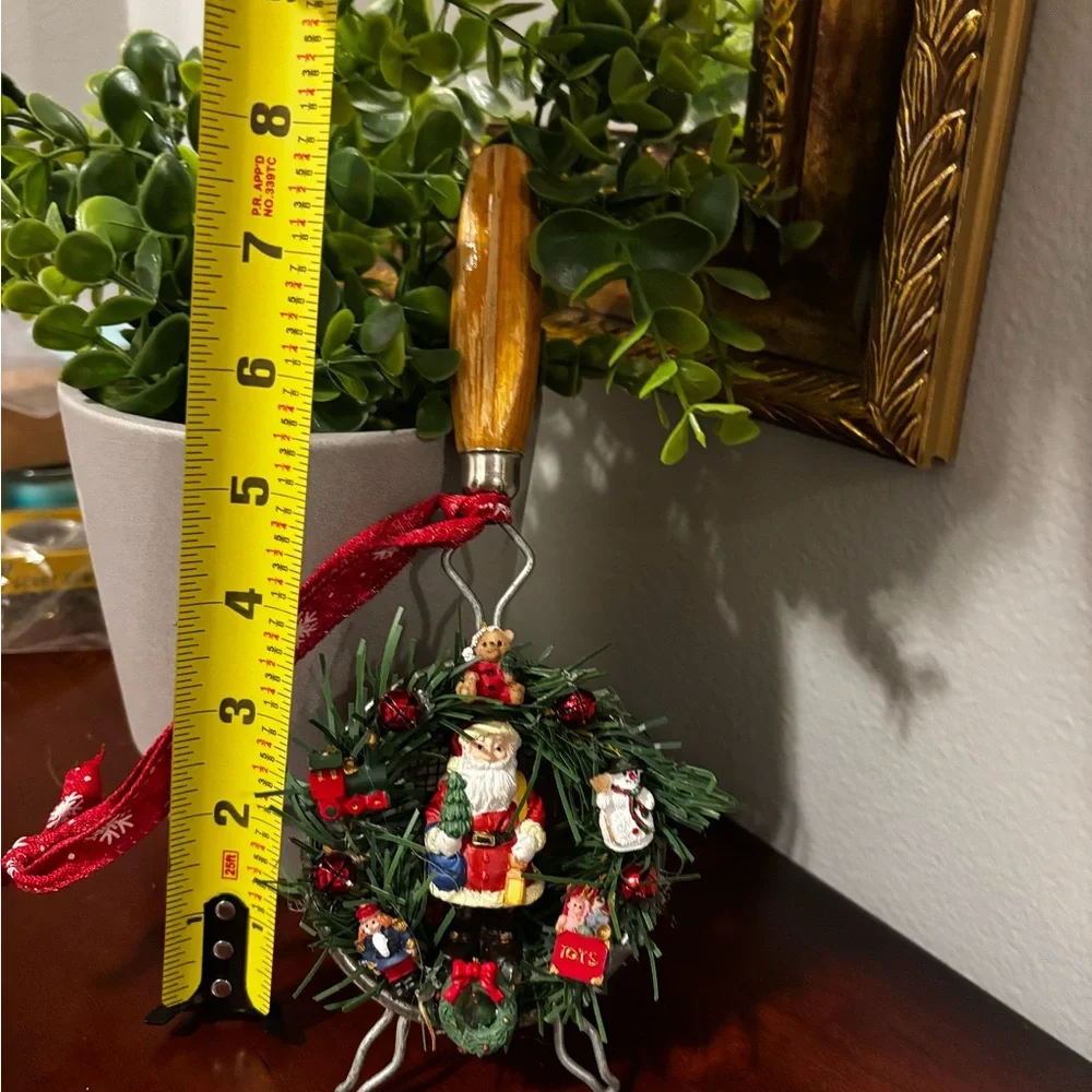 Handmade Santa Holiday Wreath on an old tea strainer.